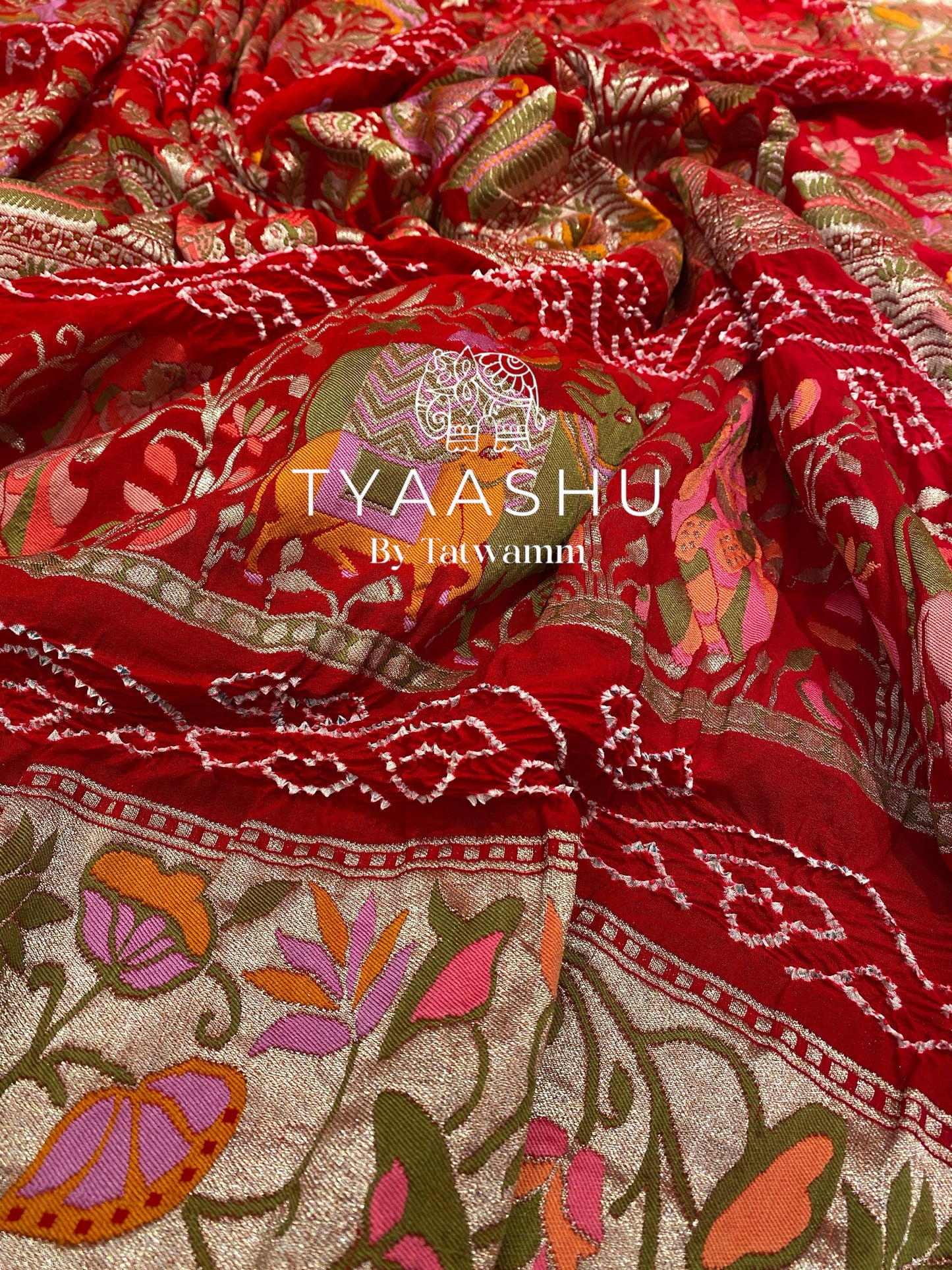 RED BANDHANI SAREE WITH INTRICATE MEENAKARI